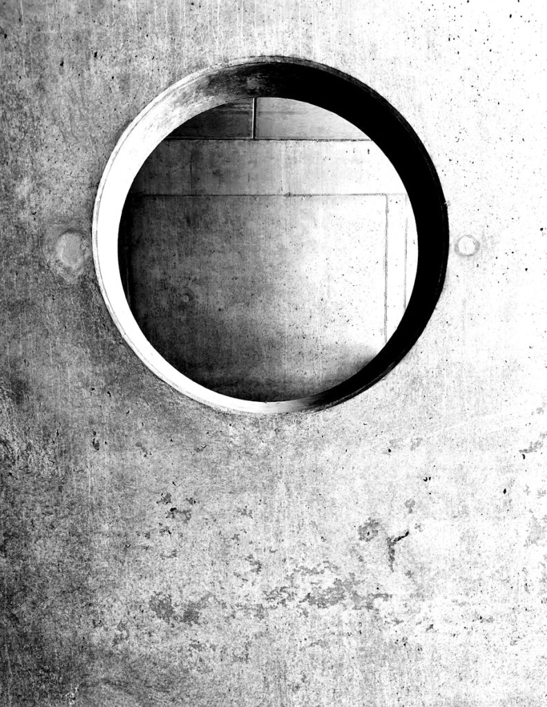 A round hole in a concrete wall